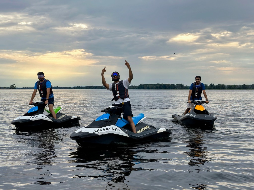 Jet skiing on open lake with friends